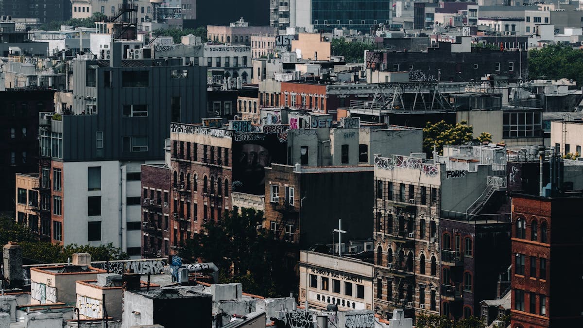 NYC urban rooftops aerial view — roof leak inspection and water damage
