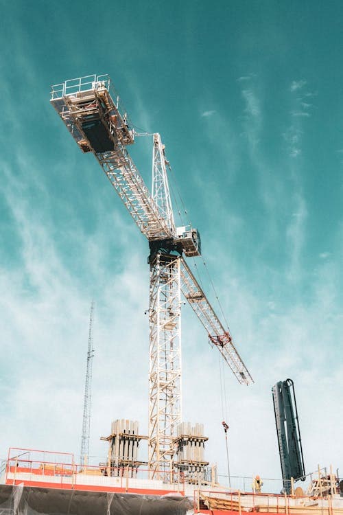 Towering crane at construction site
