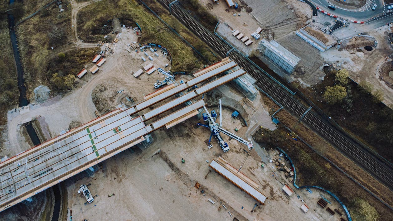 Urban bridge construction site with machinery