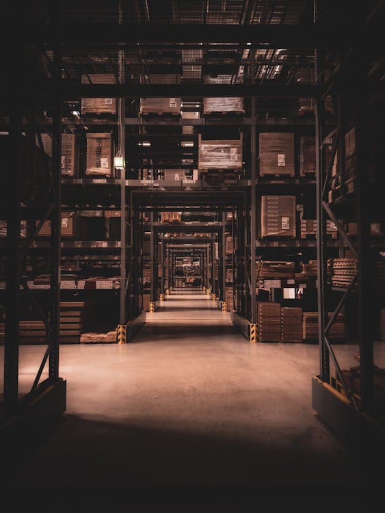 Industrial warehouse aisle with shelving